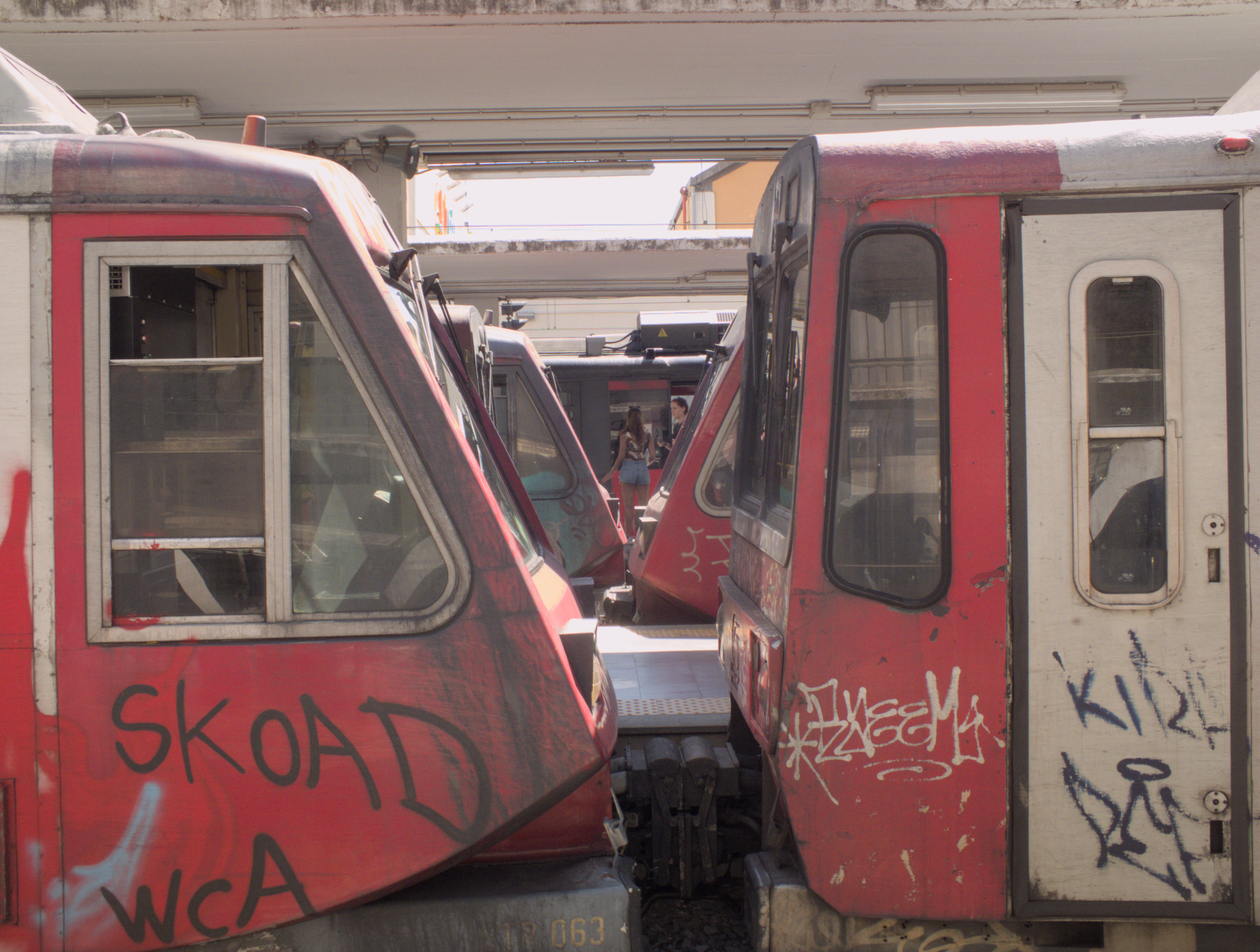 Two FE220 and T21 trains at Napoli Porta Nolana station on the Circumvesuviana railway